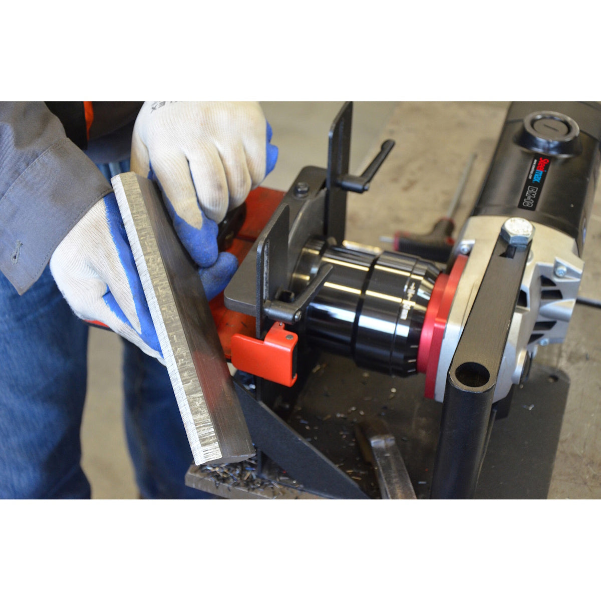 Steelmax 120V BM18 Portable Beveling Machine SM-BM18: Worker in gloves operates radius head tool for plate edge finishing.