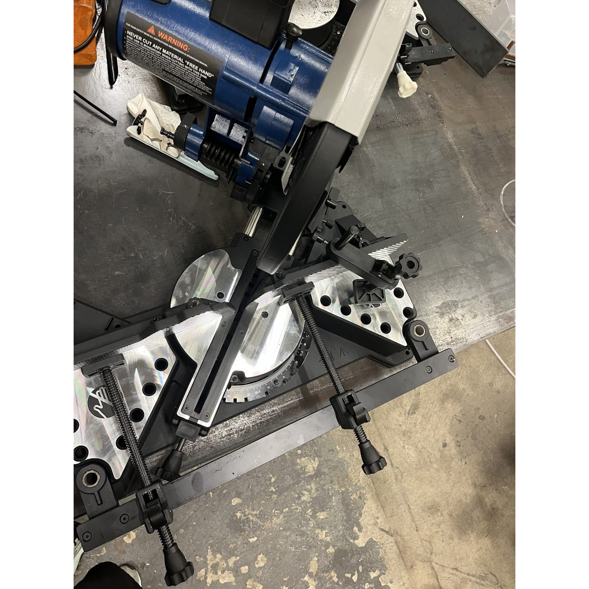Steelmax 120V 14″ Miter Saw SM-S-14-M set up on a workbench, ready for precision metal cutting tasks.